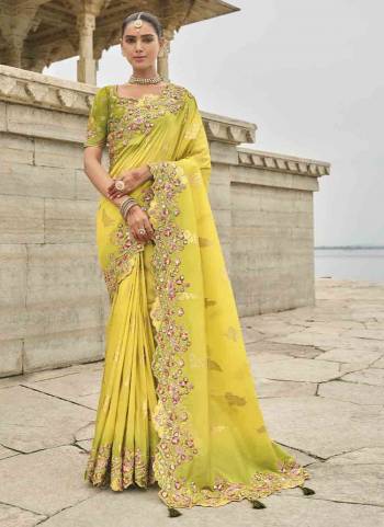 Attrective These Party Wear Saree in Fine Colored.These Saree Are Viscose Tissue Silk And Blouse is Fabricated On Raw Silk.Its Beautified With Wevon Butti Designer With Sequance Embroidery,Stone,Cut Work .