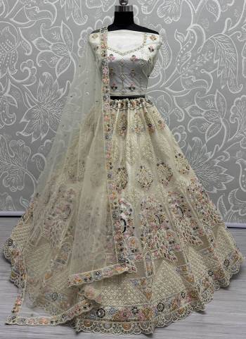 For A Fancy Designer Look,Grab These Lehenga Choli With Dupatta in Fine Colored.These Lehenga And Choli Are Net And Dupatta Are Fabricated On Net Pair.Its Beautified With Designer Sequance,Multy Thread,Dori Embroidery,Zarkan Work.