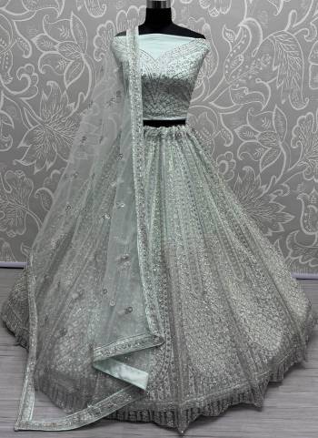 For A Fancy Designer Look,Grab These Lehenga Choli With Dupatta in Fine Colored.These Lehenga And Choli Are Net And Dupatta Are Fabricated On Net Pair.Its Beautified With Designer Sequance,Multy Thread Embroidery,Zarkan Diamond Work.