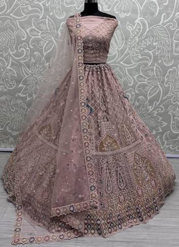 For A Fancy Designer Look,Grab These Lehenga Choli With Dupatta in Fine Colored.These Lehenga And Choli Are Net And Dupatta Are Fabricated On Net Pair.Its Beautified With Peacock Designer Dori,Sequance,Multy Thread Embroidery,Zarkan Diamond Work.
