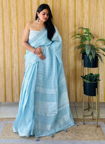 Garb These Fastive Wear Saree in Fine Colored.These Saree And Blouse is Fabricated On Linen.Its Beautified With Wevon Designer.