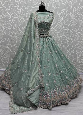 For A Fancy Designer Look,Grab These Lehenga Choli With Dupatta in Fine Colored.These Lehenga And Choli Are Silk And Dupatta Are Fabricated On Soft Net Pair.Its Beautified With Peacock Designer Dori,Sequance,Thread Embroidery,Hand Work.