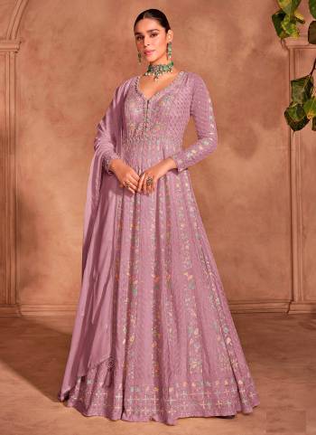 Garb These Party Wear Designer Anarkali Suits in Fine Colored Pair With Dupatta.These Top And Dupatta Are Fabricated On Chinon Pair With Santoon Bottom.Its Beautified With Designer Heavy Embroidery Work.