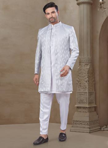 Looking These Party Wear Mans Wear Indo Western Top Bottom With Jacket wearing this fashionable. Tailored Top Bottom Are Malai Silk And Jacket On Jacquard Fabriced With Designer Embroidery Work,Position Printed Jacket and fashioned with a banded collar for a dash of style.