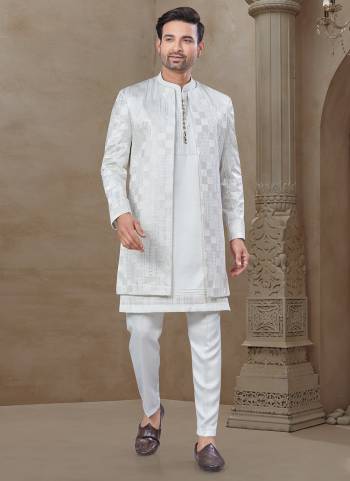 Looking These Party Wear Mans Wear Indo Western Top Bottom With Jacket wearing this fashionable. Tailored Top Bottom Are Malai Silk And Jacket On Jacquard Fabriced With Designer Embroidery Work,Position Printed Jacket and fashioned with a banded collar for a dash of style.