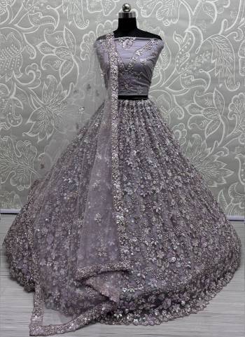 For A Fancy Designer Look,Grab These Lehenga Choli With Dupatta in Fine Colored.These Lehenga Are Net Crafted And Choli Are Net And Dupatta Are Fabricated On Soft Net Pair.Its Beautified With Heavy Designer Sequance,Thread Embroidery Work.