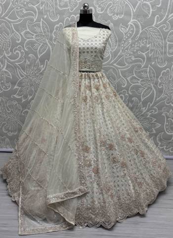 For A Fancy Designer Look,Grab These Lehenga Choli With Dupatta in Fine Colored.These Lehenga Are Net Crafted And Choli Are Net And Dupatta Are Fabricated On Soft Net Pair.Its Beautified With Heavy Designer Sequance,Thread Embroidery Work.