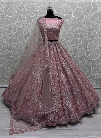 For A Fancy Designer Look,Grab These Lehenga Choli With Dupatta in Fine Colored.These Lehenga And Choli Are Net And Dupatta Are Fabricated On Soft Net Pair.Its Beautified With Designer Sequance,Thread Embroidery,Zircon Work.