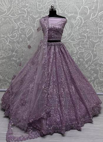 For A Fancy Designer Look,Grab These Lehenga Choli With Dupatta in Fine Colored.These Lehenga And Choli Are Net And Dupatta Are Fabricated On Soft Net Pair.Its Beautified With Designer Sequance,Thread Embroidery,Zircon Work.