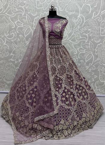 For A Fancy Designer Look,Grab These Lehenga Choli With Dupatta in Fine Colored.These Lehenga Are Double Net Crafted And Choli Are Net And Dupatta Are Fabricated On Soft Net Pair.Its Beautified With Designer Sequance,Multy Thread,Dori Embroidery Work.