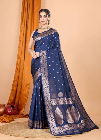Garb This Party Wear Saree Paired With Blouse.This Saree And Blouse Are Soft Banarasi Silk Based Fabric With Wevon Jari Designer. Buy This Pretty Saree Now.