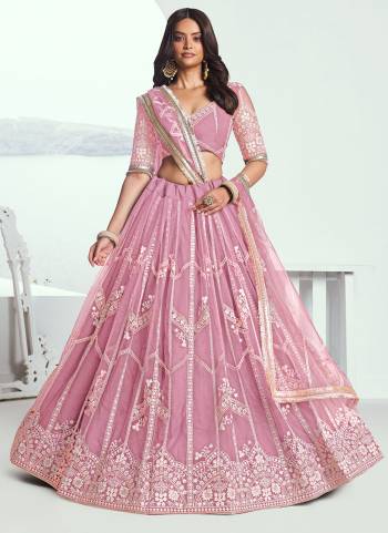 For A Different Look,Grab These Party Wear Designer Lehenga in All Over Pretty Colored Pair With Blouse And Dupatta.These Lehenga Choli And Dupatta is All Over Butterfly Net Base Fabric With Designer Thread Embroidery Work.