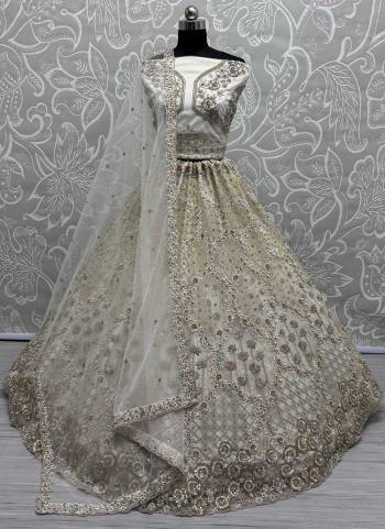 For A Fancy Designer Look,Grab These Lehenga Choli With Dupatta in Fine Colored.These Lehenga Are Net And Choli Are Net And Dupatta Are Fabricated On Soft Net Pair.Its Beautified With Designer Sequance,Thread,Dori,Badala Patti Embroidery With Zircon Diamond Work.