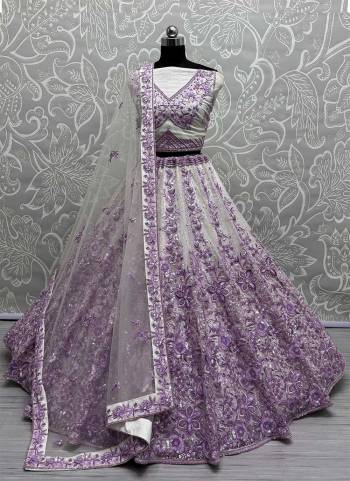 For A Fancy Designer Look,Grab These Lehenga Choli With Dupatta in Fine Colored.These Lehenga Are Net And Choli Are Net And Dupatta Are Fabricated On Soft Net Pair.Its Beautified With Designer Fancy Flowar Tone To Tone Sequance,Multy Thread,Dori Embroidery Work.