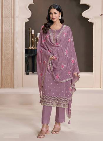 Purple colored Salwar Suit is prettified with Embroidery work And Sequence Work as shown which makes it appear classy. This top is made of Silk fabric which is accompanied with Santoon Bottom,Santoon Inner and Georgette dupatta. Women can buy this suit to wear for their parties and functions.