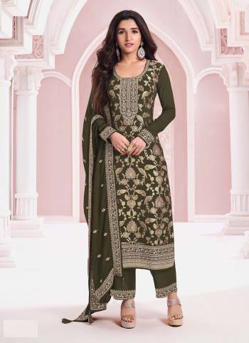 Mahendi colored Pakistani Suit is prettified with Embroidery work,Sequence Work And Zari as shown which makes it appear classy. This top is made of Pure Jacquard Viscos fabric which is accompanied with Santoon Bottom,Santoon Inner and Chinon dupatta. Women can buy this suit to wear for their parties and functions.