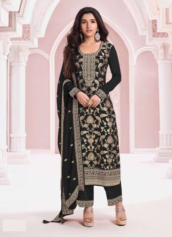 Black colored Pakistani Suit is prettified with Embroidery work,Sequence Work And Zari as shown which makes it appear classy. This top is made of Pure Jacquard Viscos fabric which is accompanied with Santoon Bottom,Santoon Inner and Chinon dupatta. Women can buy this suit to wear for their parties and functions.