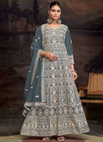 Garb These Designer Anarkali Suit in Fine Colored Pair With Bottom And Dupatta.These Top Are Net And Dupatta Are Fabricated On Net Pair With Santoon Bottom.Its Beautified With Santoon Inner.Its Beautified With Heavy Designer Embroidery Work.