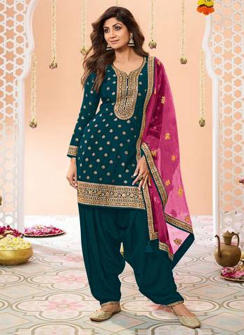 Garb These Designer Patiyala Suit in Fine Colored Pair With Bottom And Dupatta.These Top Are Jacquard Silk And Dupatta Are Fabricated On Net Pair With Santoon Bottom.Its Beautified With Santoon Inner.Its Beautified With Wevon Designer, Embroidery Work.