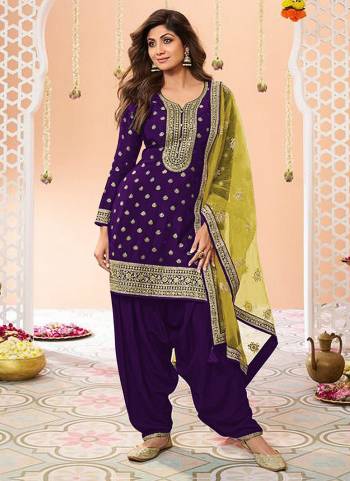 Garb These Designer Patiyala Suit in Fine Colored Pair With Bottom And Dupatta.These Top Are Jacquard Silk And Dupatta Are Fabricated On Net Pair With Santoon Bottom.Its Beautified With Santoon Inner.Its Beautified With Wevon Designer, Embroidery Work.
