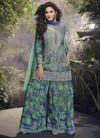 Garb These Party Wear Designer Plazzo Suits in Fine Colored Pair With Dupatta.These Top Are Chinon And Dupatta Are Fabricated On Net Pair With Chinon Bottom.Its Beautified With Printed,Designer Embroidery Work