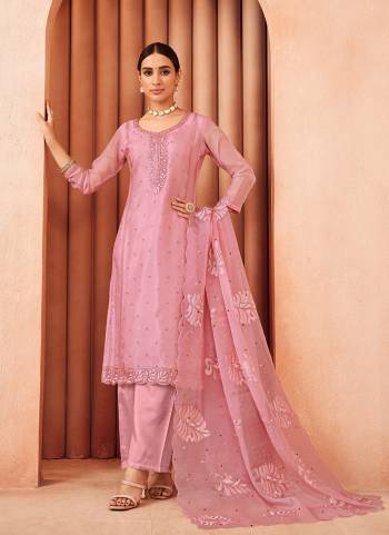  Looking These Party Wear Suit in Fine Colored Pair With Bottom And Dupatta.These Top Are Organza And Dupatta Are Fabricated On Organza Pair With Dull Santoon Bottom.Its Beautified With Designe Heavy Thread Embroidery Work.