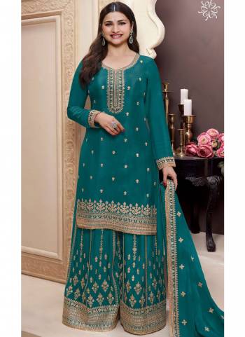  Looking These Party Wear Sharara Suit in Fine Colored Pair With Bottom And Dupatta.These Top Are Chinon And Dupatta Are Fabricated On Chinon Pair With Chinon Bottom.Its Beautified With Heavy Designer Embroidery Work.