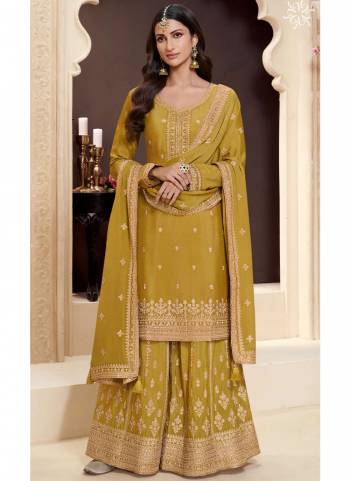  Looking These Party Wear Sharara Suit in Fine Colored Pair With Bottom And Dupatta.These Top Are Chinon And Dupatta Are Fabricated On Chinon Pair With Chinon Bottom.Its Beautified With Heavy Designer Embroidery Work.