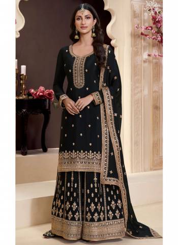  Looking These Party Wear Sharara Suit in Fine Colored Pair With Bottom And Dupatta.These Top Are Chinon And Dupatta Are Fabricated On Chinon Pair With Chinon Bottom.Its Beautified With Heavy Designer Embroidery Work.