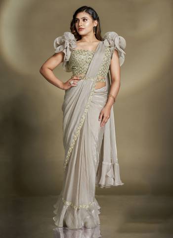 Look Attrective These Designer Party Wear Ready To Wear Saree With Blouse in Fine Colored.These Saree Are Two Tone Satin Silk And Blouse Crepe is Fabricated.Its Beautified Solid,Desiger Sequance,Beads,Aari Hand Work And Belt.