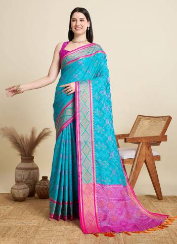 Garb This Party Wear Saree Paired With Blouse.This Saree And Blouse Are Patola Silk Fabric With Wevon Meenakari Designer. Buy This Pretty Saree Now.