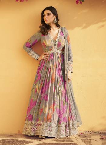 Garb These Party Wear Anarkali Suit in Fine Colored Pair With Dupatta.These Top Are Chinon And Dupatta Are Net And Pair With Santoon Inner.Its Beautified With Designer Printed With Embroidery Work.