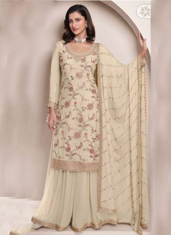  Looking These Party Wear Sharara Suit in Fine Colored Pair With Bottom And Dupatta.These Top Are Chinon And Dupatta Are Fabricated On Chinon Pair With Chinon Bottom.Its Beautified With Designer Embroidery With Hand Work.
