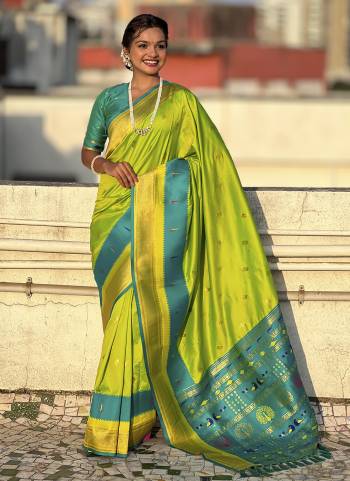 Garb These Party Wear Saree in Fine Colored.These Saree And Blouse is Fabricated On Paithani Silk.Its Beautified With Weaving Gold Jari Peacock Designer.