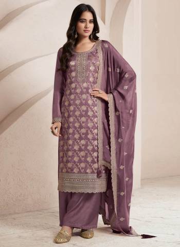 Purple Colored Pakistani Suit is prettified with Embroidery work,Zari And Sequence Work as shown which makes it appear classy. This top is made of Jacquard fabric which is accompanied with Santoon Bottom,Santoon Inner and Chinon dupatta. Women can buy this suit to wear for their parties and functions.