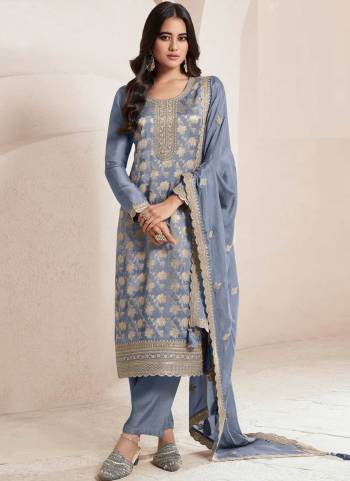 Grey Colored Pakistani Suit is prettified with Embroidery work,Zari And Sequence Work as shown which makes it appear classy. This top is made of Jacquard fabric which is accompanied with Santoon Bottom,Santoon Inner and Chinon dupatta. Women can buy this suit to wear for their parties and functions.