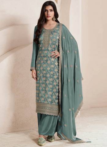 Green Colored Pakistani Suit is prettified with Embroidery work,Zari And Sequence Work as shown which makes it appear classy. This top is made of Jacquard fabric which is accompanied with Santoon Bottom,Santoon Inner and Chinon dupatta. Women can buy this suit to wear for their parties and functions.