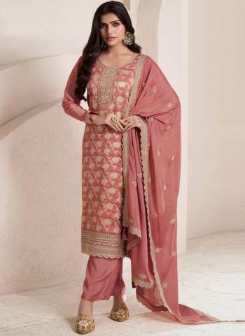 Orange Colored Pakistani Suit is prettified with Embroidery work,Zari And Sequence Work as shown which makes it appear classy. This top is made of Jacquard fabric which is accompanied with Santoon Bottom,Santoon Inner and Chinon dupatta. Women can buy this suit to wear for their parties and functions.