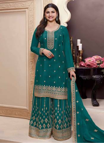 Aqua Green Colored Palazo Suit is prettified with Embroidery work,Zari And Sequence Work as shown which makes it appear classy. This top is made of Chinon fabric which is accompanied with Chinon Bottom,Santoon Inner and Chinon dupatta. Women can buy this suit to wear for their parties and functions.