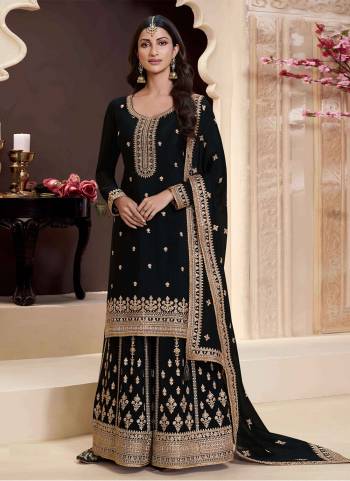 Black Colored Palazo Suit is prettified with Embroidery work,Zari And Sequence Work as shown which makes it appear classy. This top is made of Chinon fabric which is accompanied with Chinon Bottom,Santoon Inner and Chinon dupatta. Women can buy this suit to wear for their parties and functions.