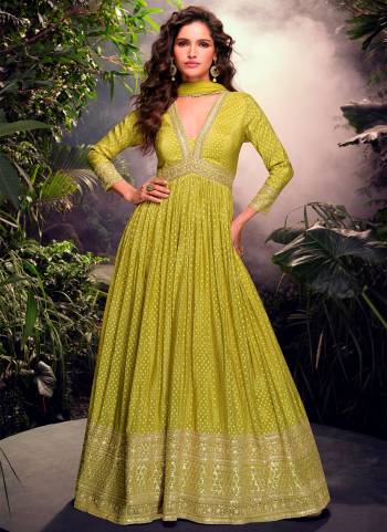 Garb These Party Wear Anarkali Suit in Fine Colored Pair With Dupatta.These Top Are Jacquard Silk And Dupatta Are Net And Pair With Crepe Inner.Its Beautified With Heavy Wevon Jacquard Designer With Embroidery Work.