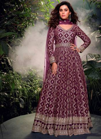 Garb These Party Wear Anarkali Suit in Fine Colored Pair With Dupatta.These Top Are Jacquard Silk And Dupatta Are Net And Pair With Crepe Inner.Its Beautified With Heavy Wevon Jacquard Designer With Embroidery Work.