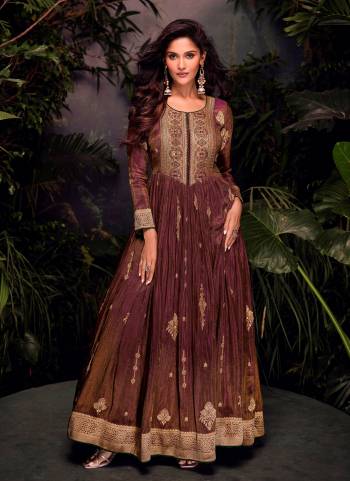 Garb These Party Wear Anarkali Suit in Fine Colored Pair With Dupatta.These Top Are Jacquard Silk And Dupatta Are Net And Pair With Crepe Inner.Its Beautified With Heavy Wevon Jacquard Designer With Embroidery Work.