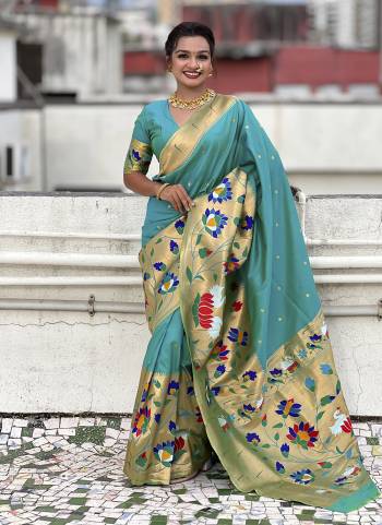 Garb These Party Wear Saree in Fine Colored.These Saree And Blouse is Fabricated On Paithani Silk.Its Beautified With Weaving Meenakari Polka Motifs Designer.