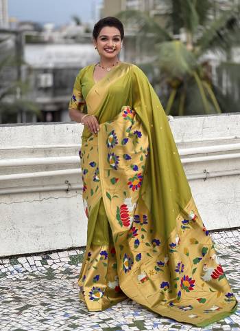 Garb These Party Wear Saree in Fine Colored.These Saree And Blouse is Fabricated On Paithani Silk.Its Beautified With Weaving Meenakari Polka Motifs Designer.
