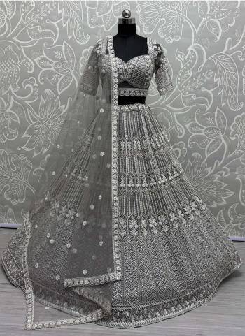 For A Fancy Designer Look,Grab These Lehenga Choli With Dupatta in Fine Colored.These Lehenga And Choli Are Net And Dupatta Are Fabricated On Soft Net Pair.Its Beautified With Heavy Fancy Designer Sequance Embroidery,Hand Work.