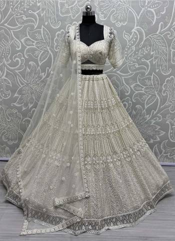 For A Fancy Designer Look,Grab These Lehenga Choli With Dupatta in Fine Colored.These Lehenga And Choli Are Net And Dupatta Are Fabricated On Soft Net Pair.Its Beautified With Heavy Fancy Designer Sequance Embroidery,Hand Work.