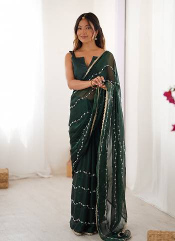Looking These Party Wear Saree in Fine Colored.These Saree Are Sitara Chiffon And Blouse is Mono Banglori Fabricated.Its Beautified With Designer Beads Moti,Val Sequance Embroidery Work With Codding Lace Border.