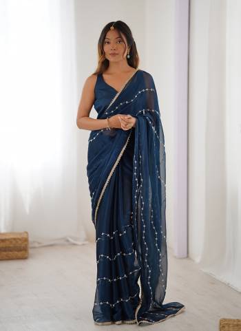 Looking These Party Wear Saree in Fine Colored.These Saree Are Sitara Chiffon And Blouse is Mono Banglori Fabricated.Its Beautified With Designer Beads Moti,Val Sequance Embroidery Work With Codding Lace Border.