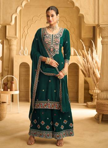 Garb These Party Wear Designer Plazzo Suits in Fine Colored Pair With Dupatta.These Top Are Velvet And Dupatta Are Fabricated On Velvet Pair With Velvet Bottom.Its Beautified With Designer Embroidery Work.